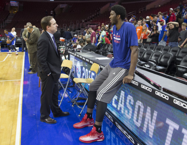 PHILADELPHIA, PA - APRIL 13: Philadelphia 76ers General Manager Sam Hinkie talks to Joel Embiid #21 prior to the game against the Milwaukee Bucks on April 13, 2015 at the Wells Fargo Center in Philadelphia, Pennsylvania. NOTE TO USER: User expressly acknowledges and agrees that, by downloading and or using this photograph, User is consenting to the terms and conditions of the Getty Images License Agreement (Photo by Mitchell Leff/Getty Images)