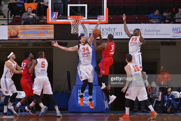 Jordan Bachynski blocks shot as teammate Jimmer Fredette looks on. (Getty Images)