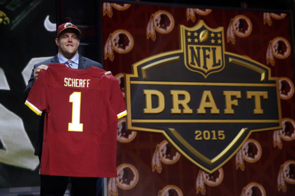 Iowa offensive lineman Brandon Scherff poses for photos after being selected by the Washington Redskins as the fifth pick in the first round of the 2015 NFL Draft,  Thursday, April 30, 2015, in Chicago. (AP Photo/Charles Rex Arbogast)