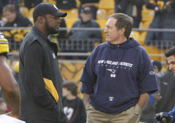 Pittsburgh Steelers head coach Mike Tomlin, left, talks with New England Patriots head coach Bill Belichick as the teams warmup before their NFL football game on Sunday, Oct. 30, 2011, in Pittsburgh. (AP Photo/Gene J. Puskar)