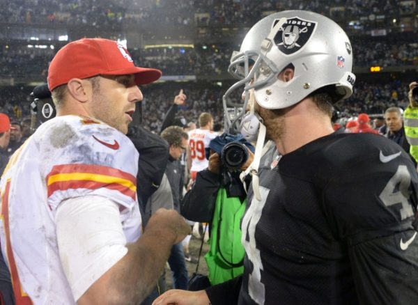 Nov 20, 2014; Oakland, CA, USA; Oakland Raiders quarterback Derek Carr (4) shakes hands with Kansas City Chiefs quarterback Alex Smith (11) after the game at O.co Coliseum. The Raiders defeated the Chiefs 24-20. Mandatory Credit: Kirby Lee-USA TODAY Sports