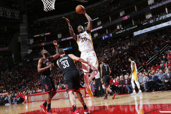 Ryan Anderson and James Harden of the Houston Rockets play defense on Julius Randle of the Los Angeles Lakers